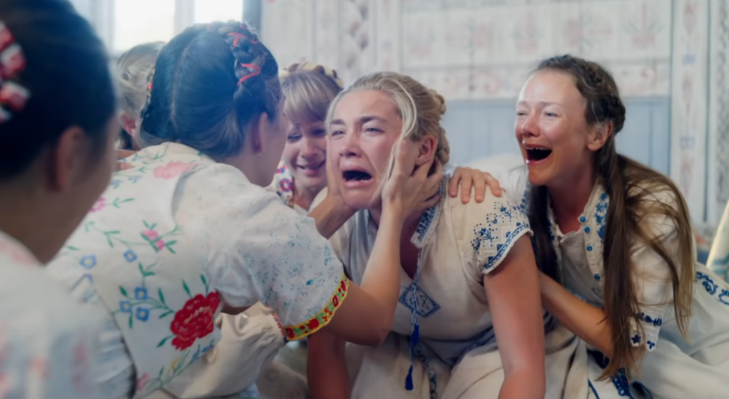 Dani simultaneously experiencing existential brokenness and the assurance of communal emotional support in Midsommar.