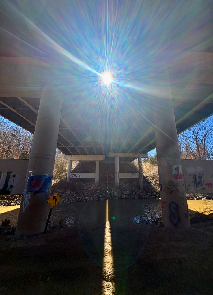 light shining through a bridge